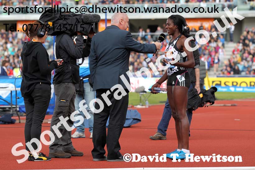 Christine Ohuruogu does an interview for TV after winning the womens 400 metres at the Sainsbury's Birmingham Grand Prix. Photos: David T. Hewitson/Sports for All Pics